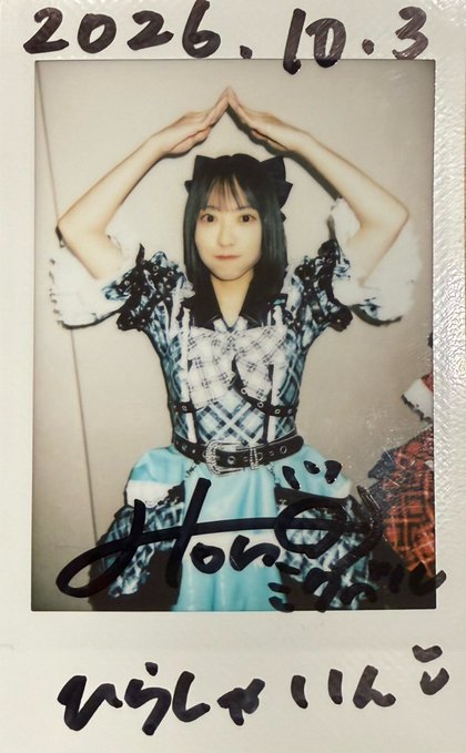 A Polaroid-style photo dated "2026.10.3" shows a young performer in a blue and black outfit with cat-ear headband, arms raised above her head, with handwritten Japanese notes.