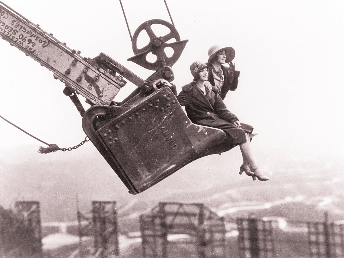 rabidrobot42's tweet photo. Ladies in a steam shovel bucket, behind the Hollywoodland sign, 1923.   

   https://t.co/fRxGw6FHLo https://t.co/97C57GPCUq