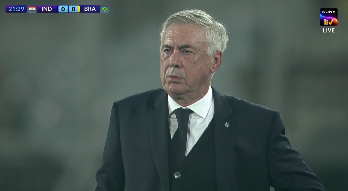 arism_ray's tweet photo. Everyone is dying with the heat in Kolkata meanwhile Carlo Anceloti turned up in a 3 piece suit for a friendly. How? 😭 https://t.co/sI9PQX4k7M