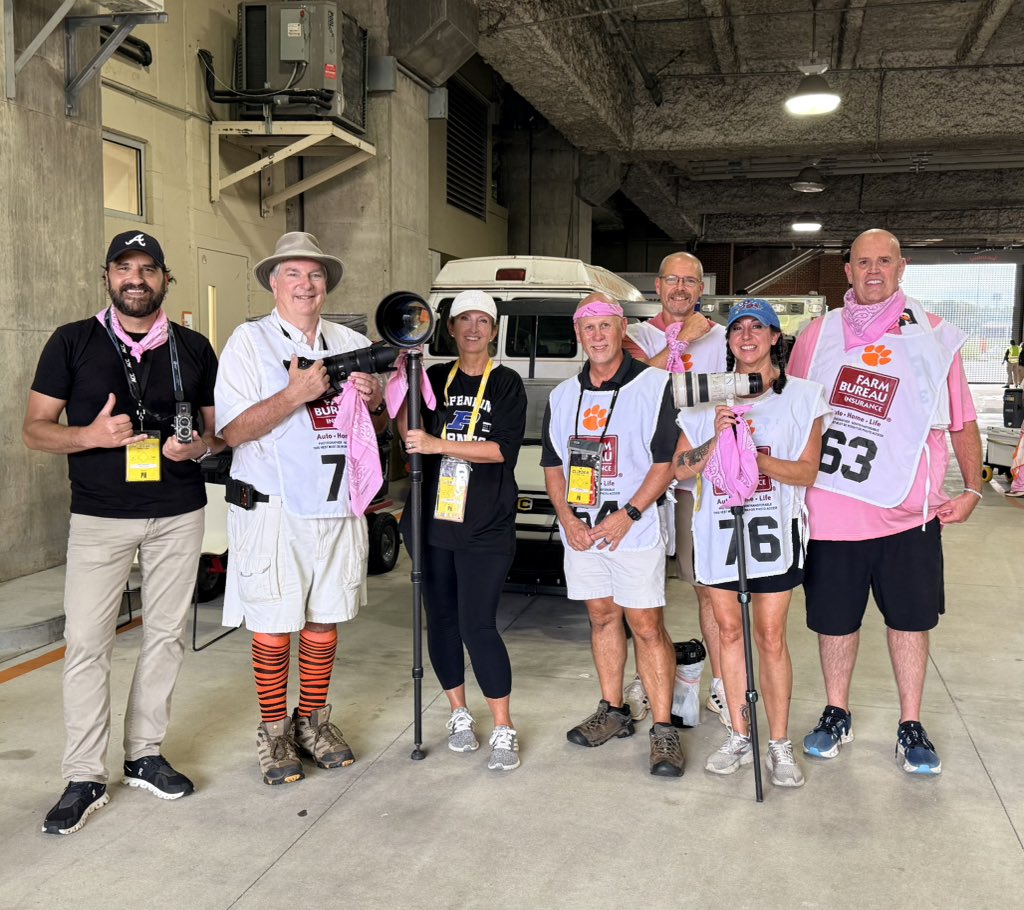 merrellmann's tweet photo. The photo crew, different Clemson media outlets, all coming together in pink bandanas to show support for Nikki Hood! One more round of chemo before she gets to ring the bell!! She is absolutely crushing it, and we are so proud of her!!!! 💕 

@ClemsonTigerNet @MDavidHood @CUnik08 @PaulStrelowTI @CFravel247 @parkers_tiger @bartboat