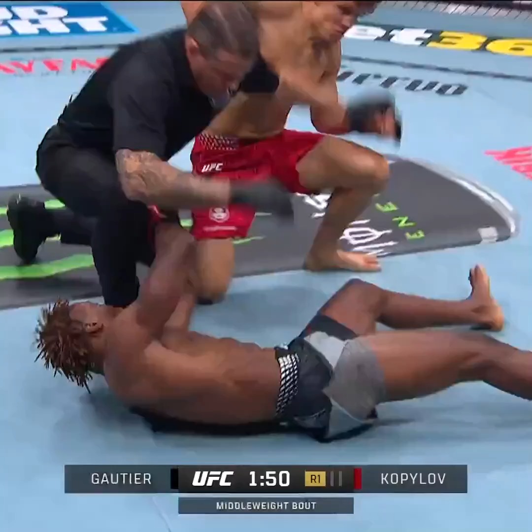 A UFC middleweight bout between Gautier and Kopylov is shown at 1:50 in Round 1, with referee intervention underway as Gautier lies on the canvas and Kopylov stands over him, capturing the decisive moment of Kopylov's victory.