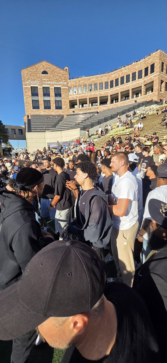RyanGreeneDNVR's tweet photo. Nikola Jokic and the Nuggets sideline at the Buffs game https://t.co/jstoAwYvFR