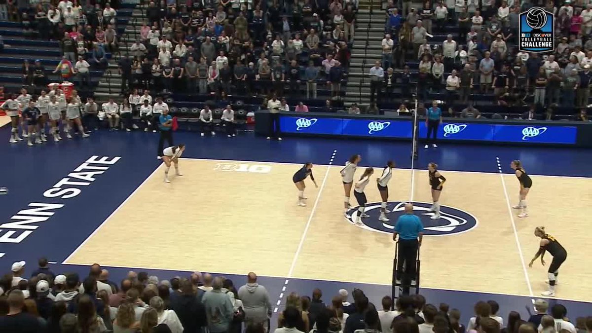 A women's volleyball match in progress at Penn State during a Discover Volleyball Challenge event, with players on the court and a crowd in the stands.