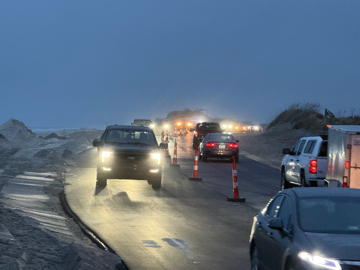 NCDOT_NC12's tweet photo. Here it is! TWO LANES of traffic on NC12 at the Pea Island Visitor Center. Again, continue to drive with caution through the area, as there is still water on the road in places and the road shoulders are soft. Thanks for your patience as we made the switchover this evening. https://t.co/n6yFRuR8wo