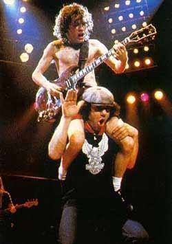 crockpics's tweet photo. Angus Young rides on Brian Johnson's shoulders on AC/DC's For Those About to Rock tour of 1981 to 1982, the shot that fronted the band's official 1982 UK tour programme. 
⚡ For Those About to Rock was AC/DC's first No. 1 album in America. Where does it rank among your favorite AC/DC records? ⚡ 👇️