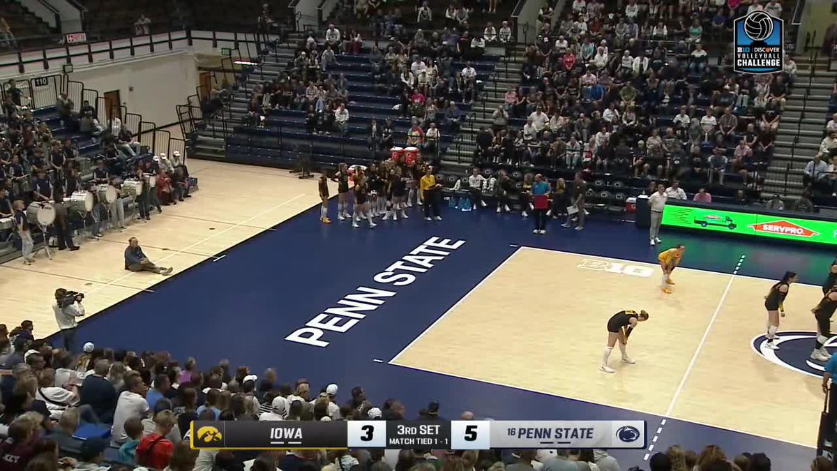 A volleyball match between Iowa and Penn State during the 'Discover Replay Challenge,' with Penn State leading 5-3 in the 3rd set, tied 1-1 in the match.