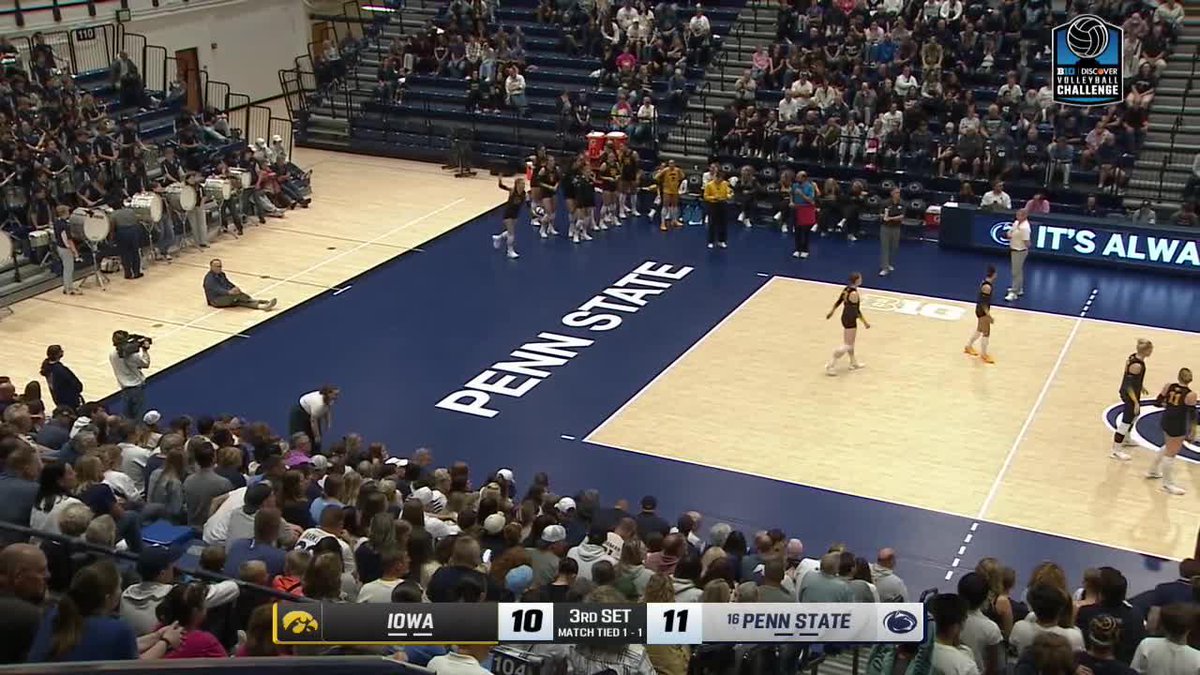 A screenshot of a women's volleyball match between Iowa (score 10) and #16 Penn State (score 11) during the 3rd set, with 'PENN STATE' displayed on the court and a scoreboard graphic at the bottom.