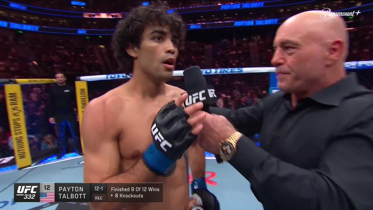 UFC fighter Payton Talbott (12-1 record) is interviewed by Joe Rogan in the octagon after a bout at UFC 332, with 'Nothing Stops Miami' visible on the cage padding.
