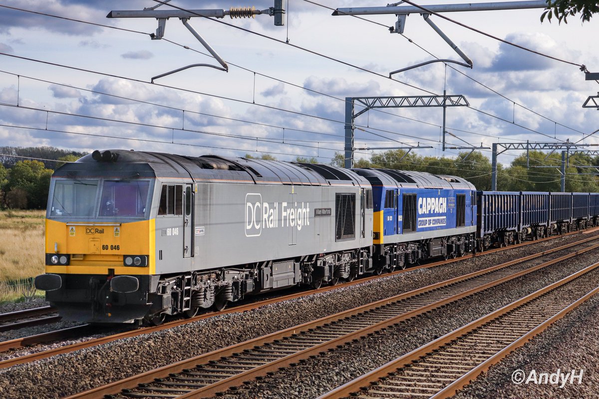 holtona72's tweet photo. Double #SixtySunday on the #MML. A nice double headed pairing for @DCRailOfficial 6D23 Wembley Receptions 1-7 to Chaddesden Sidings yesterday afternoon. Seen passing Isham on the #MML with 60046 'William Wilberforce' leading & recently named 60028 'Knockmealdown' behind. 3/10/26 https://t.co/zesdLTEca8