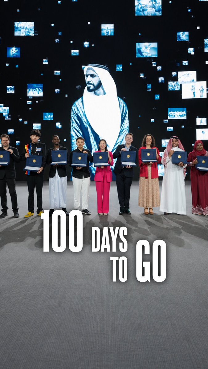 A promotional image for the "100 DAYS TO GO" countdown shows a diverse group of people holding blue folders, standing beneath a large portrait of a man in traditional Arab attire, likely related to a UAE event.
