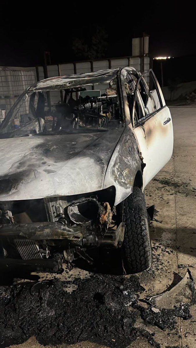MustafaBarghou1's tweet photo. Israeli terrorist settlers burn a vehicle and spray hostile slogans during an attack on a home in the Wadi Jahish area of as-Samu town, south of Hebron. https://t.co/wzQqR0vCqY