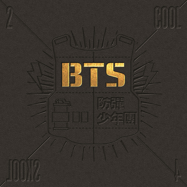 The album cover for BTS's 'Cool/2 Cool 4 Skool' featuring a black tactical vest with 'BTS' in gold lettering and '防彈少年團' (Bulletproof Boy Scouts) in the corner.