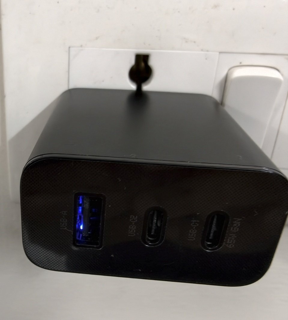 thesaturdayguy's tweet photo. @flipkartsupport @Flipkart I received a duplicate CMF 65W charger. The SN on the box and brick don’t match, the weight differs from the original, and there’s an unusual blue light inside the brick when plugged in, which the original doesn’t have. (1/2) https://t.co/OeJ88tEUhT