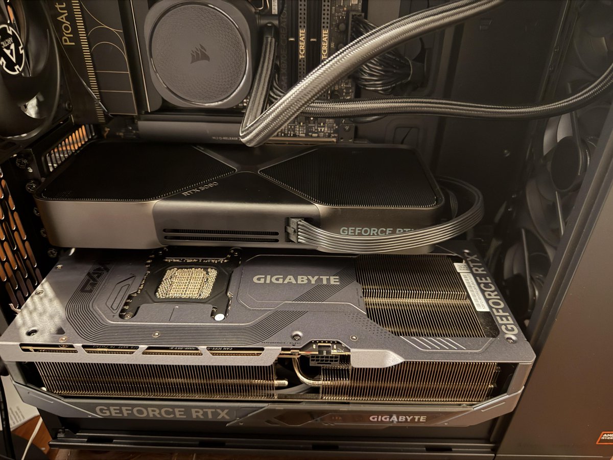GameGPU_com's tweet photo. https://t.co/N9Km89Xu3u

An enthusiast installed two GeForce RTX 5090 graphics cards into a single workstation to combine high-speed video memory for local neural networks and large language models. While the official MSRP is set at $1999, severe hardware shortages across the United States have driven actual retail prices up to $5000, with scalpers demanding over $6000 per unit.

The compact two-slot Founders Edition model looks tiny next to the massive four-slot Gigabyte Gaming OC cooler. The custom card is significantly longer and wider, requiring a spacious chassis and a sturdy support bracket.

Under sustained heavy computing workloads, the Founders Edition graphics card reaches operating temperatures of 76°, whereas the enormous Gigabyte heatsink manages to keep the core at 70° due to its larger dissipation area.

#NVIDIA #GeForceRTX5090 #RTX5090 #Gigabyte #Hardware #GamingPC #GPU
