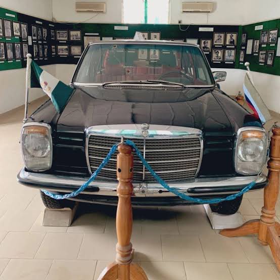 nwoko_greg62705's tweet photo. The tyres you see on the car now are not the original tyres. 

This is General Murtala Muhammed official car, a thin-skinned Mercedes Benz 230.6.

It is now about 50 years and few months old. He and two of his aides were assassinated in this car on the 13th day of February 1976, which is the same month I was born.

The car still looks very new because of maintenance at the National Museum Onikan, Lagos where it is kept in the Nigerian Government Yesterday and Today hall.

The original tyres were shredded by bullets during the ambush near the Federal Secretariat in Ikoyi. 

Those original tyres are kept inside the boot of the car. Next time you go there, ask the curator to open the boot for you to see them. 

The bullet holes are still on the windscreen, side windows and rear screen.

About the people inside the car that morning, history says there were four people in the car.

One was General Murtala Muhammed himself, Head of State, aged 37.

Two was Lieutenant Akintunde Akinsehinwa, his Aide de Camp.

Three was Staff Sergeant Adamu Michika, his driver. (He was the first to be killed making the car to stop)

Four was Staff Sergeant Michael Otuwu, his orderly. He was the only one who survived. They took all of them to the mortuary and later discovered he was still breathing. 

He is Igala from Kogi State and he is still alive to tell the story.

Ask me any question you want to know about this car.