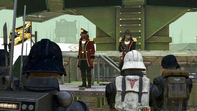 Commissars address Guardsmen from a platform