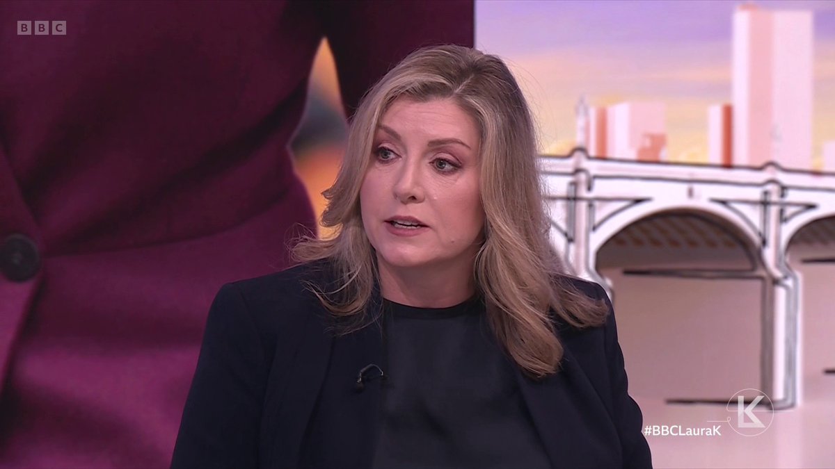 A blonde woman wearing a black blazer speaks during a BBC interview, with "#BBCLauraK" visible in the bottom right corner, likely discussing Penny Mordaunt's political stances on trans rights and the ECHR as referenced in the accompanying commentary criticizing Tory party principles.