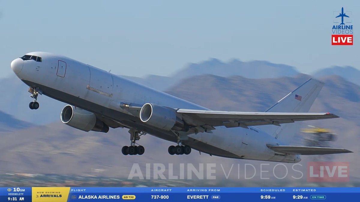 An Alaska Airlines AS 732 Boeing 737-900 takes off, with on-screen text indicating a flight arriving from Everett (PAE), on time, via Airline Videos Live.