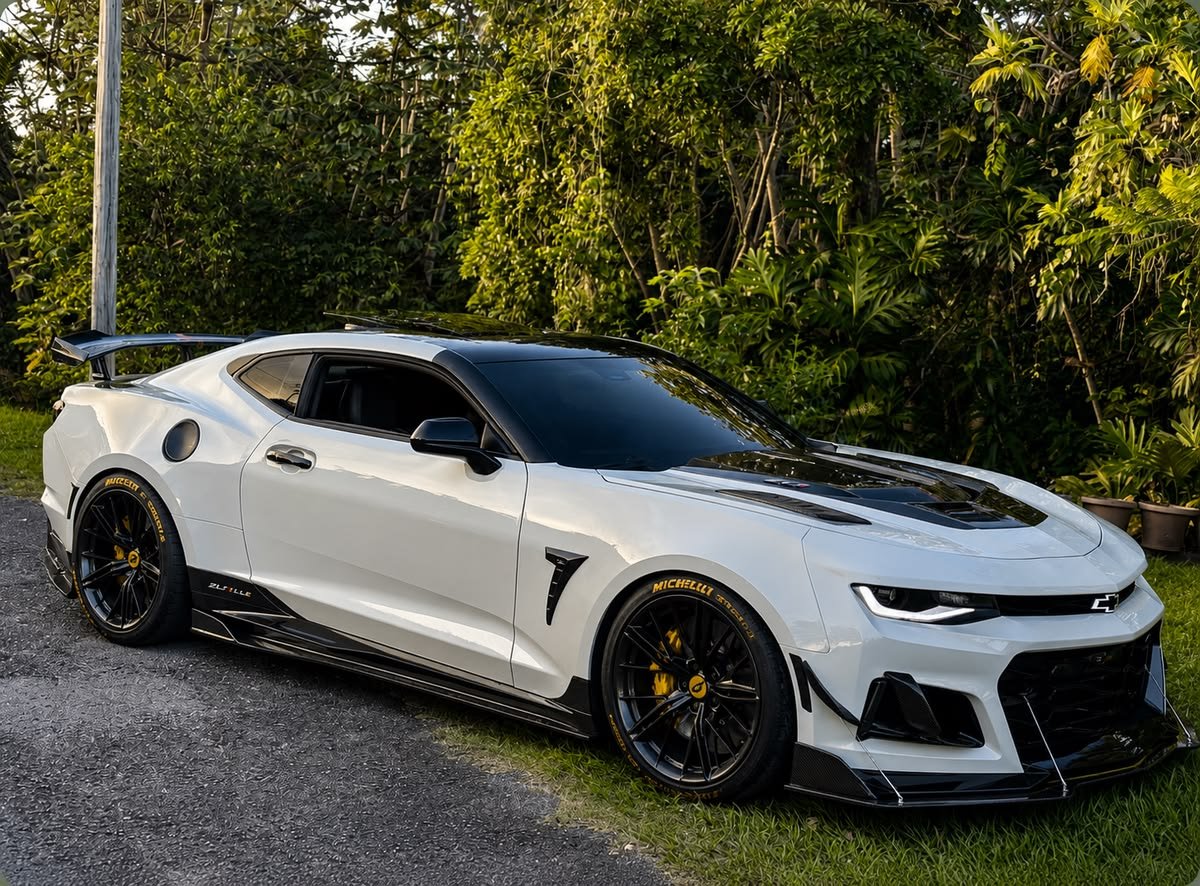 SkymanFSU96's tweet photo. Massive rear wing, splitters, and a supercharged heartbeat resting beneath that vented hood. Let it scream. 🏎️💨 https://t.co/IwNEh4vSeL