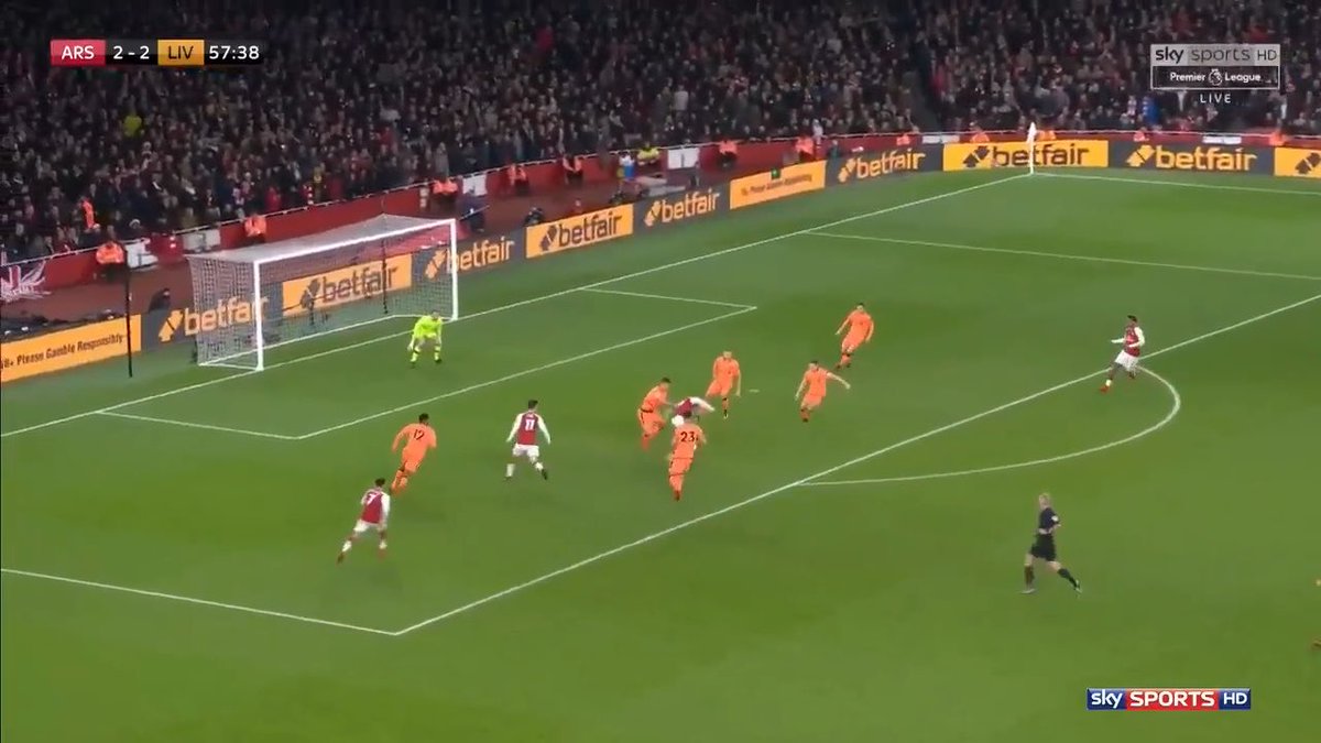 A Premier League football match between Arsenal and Liverpool shown on Sky Sports HD, with the score tied 2-2 at 57:38 during a penalty area attack by Arsenal.
