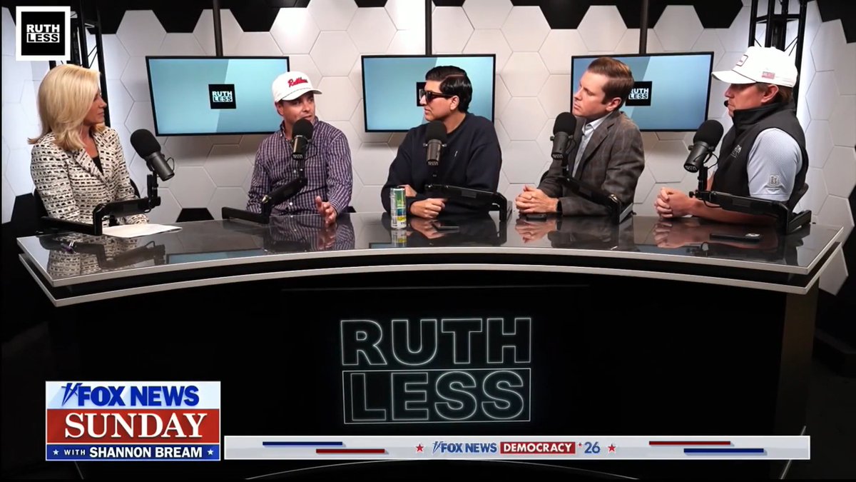 Five people sit around a curved table with "RUTHLESS" displayed on the front during a Fox News Sunday broadcast, with the lower third reading "FOX NEWS SUNDAY WITH SHANNON BREAM." The image shows the Ruthless Podcast cast panel discussing midterm election races, matching the post's description of their analysis on key races to watch in the upcoming elections.