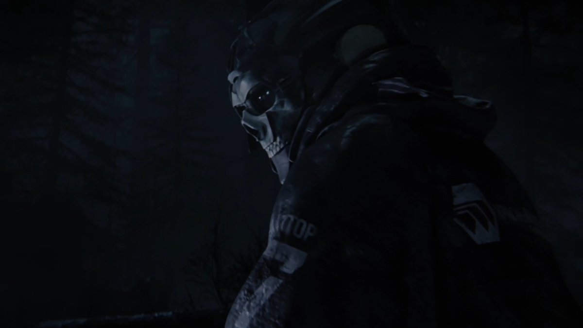 A menacing figure wearing a skull mask and tactical gear emerges from a dark, shadowy environment, with the text "STOP" visible on their sleeve. The image showcases the new appearance of the iconic "Ghost" character in Modern Warfare 4's DMZ mode, capturing the character's signature intimidating presence.