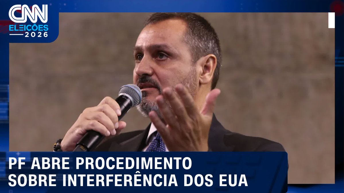 A CNN Brasil news broadcast screenshot with "CNN ELEIÇÕES 2026" logo showing a bearded man in a suit speaking into a microphone, with the headline "PF ABRE PROCEDIMENTO SOBRE INTERFERÊNCIA DOS EUA".