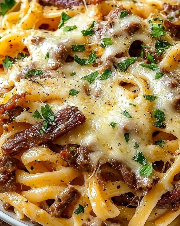 LabMariam48488's tweet photo. Cheesy Beef Fettuccine
Serves: 4
Prep Time: 10 minutes
Cook Time: 20 minutes
Total Time: 30 minutes

Ingredients

Pasta
- 340 g fettuccine or linguine
- Salt, for the pasta water
- 250 ml reserved pasta water

Beef Sauce
- 450 g ground beef
- 1 small onion, finely diced
- 3 garlic cloves, minced
- 2 tablespoons butter
- 1 tablespoon tomato paste, optional
- 1 teaspoon Italian seasoning
- ½ teaspoon salt, or to taste
- ½ teaspoon freshly ground black pepper
- 180 ml beef stock

Cream & Cheese
- 150–180 ml heavy cream
- 50 g grated Parmesan cheese
- 150–200 g shredded mozzarella cheese

Garnish
- 2 tablespoons fresh parsley, chopped
- Additional freshly ground black pepper

Method
1. Cook the pasta: Bring a large pot of salted water to a boil. Cook the fettuccine until just shy of al dente, according to the package instructions. Reserve 250 ml of the pasta water, then drain.

2. Brown the beef: Heat a large, deep skillet over medium-high heat. Add the ground beef and cook for 5–7 minutes, breaking it apart as it cooks. Add the onion and cook for 3–4 minutes until softened. Drain excess fat if necessary.

3. Build the flavour: Add the garlic, tomato paste, Italian seasoning, salt, and black pepper. Cook for 1 minute, stirring continuously.

4. Make the sauce: Add the butter and stir until melted. Pour in the beef stock and cream. Bring to a gentle simmer and cook for 2–3 minutes until the sauce begins to thicken.

5. Combine with pasta: Add the drained pasta and Parmesan. Toss thoroughly until the noodles are coated in the sauce. Add reserved pasta water a little at a time until the sauce reaches a smooth, creamy consistency.

6. Add the mozzarella: Taste and adjust the seasoning, adding extra black pepper if desired. Sprinkle the mozzarella evenly over the pasta.

7. Melt the cheese: Cover the skillet and cook over low heat for 2–3 minutes, until the mozzarella is melted and stretchy. Alternatively, place the skillet under a broiler briefly until the cheese is golden and bubbling.

8. Garnish and serve: Finish with chopped parsley and freshly cracked black pepper. Serve immediately while hot and creamy.

Chef's Notes

- Pasta water: The starch in reserved pasta water helps emulsify the sauce and gives it a smoother consistency.
- Cheese: Mozzarella provides the stretch, while Parmesan adds savoury depth.
- Beef: An 80–90% lean ground beef works well, providing flavour without making the sauce excessively greasy.
- Consistency: The sauce should coat the pasta generously without becoming overly thick. Add a splash of pasta water if it tightens while standing.
#MariamFoodLab