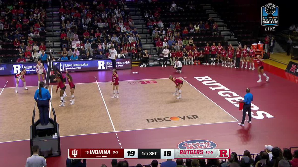 A live broadcast of a women's volleyball match between Indiana (ranked 15) and Rutgers during the Discover Wisconsin Challenge, with Indiana leading 19-18 in the first set.