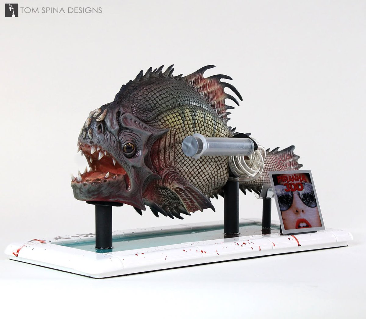 TomSpinaDesigns's tweet photo. This original silicone puppet from 2012's horror comedy #Piranha 3DDD was in great condition with its faux blood FX syringe, and just needed some "pool" theming for context. See more: https://t.co/cbs3SKjeBZ

#TomSpinaDesigns #horror #movieprops https://t.co/57AcI8iEUF