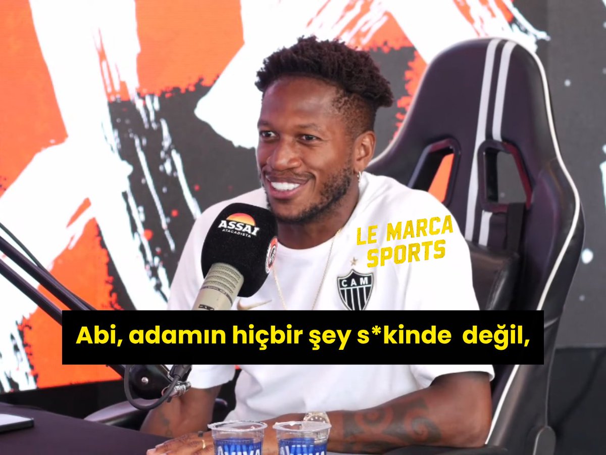 A smiling man wearing a white Atlético Mineiro (CAM) shirt is being interviewed, with the text "Abi, adamın hiçbir şey s*kinde değil," (translation: "Man, he didn't give a damn about anything,") displayed, matching the accompanying post about Fred recalling Jhon Duran's laid-back attitude toward training.