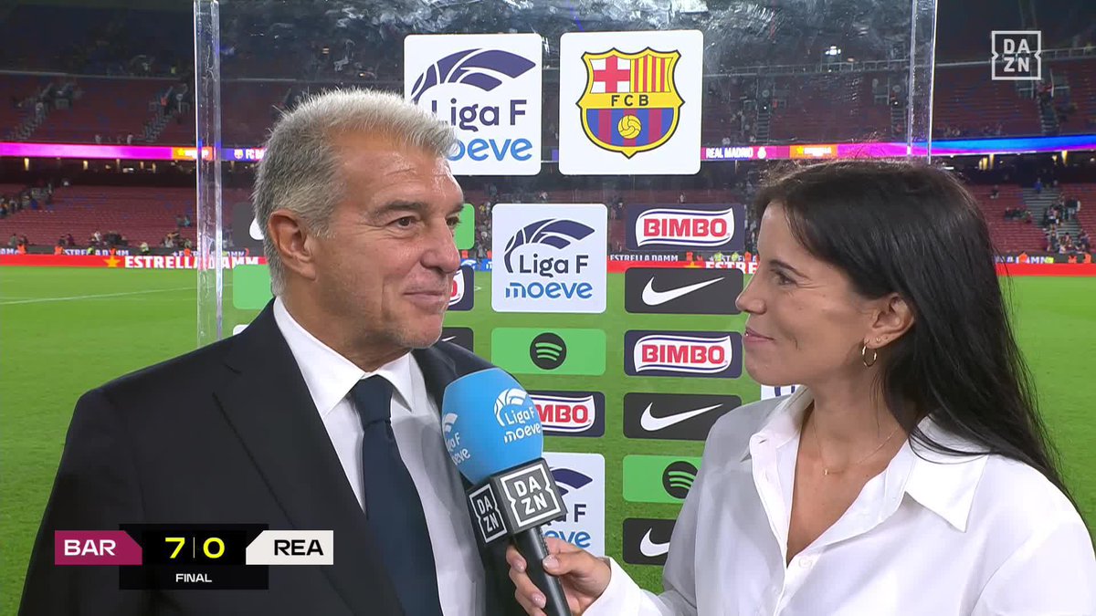 A post-match interview on DAZN after FC Barcelona's 7-0 victory over Real Madrid in Liga F, showing a man in a suit being interviewed by a reporter holding a DAZN microphone.