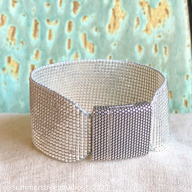 ellin_anderson's tweet photo. Dazzling beaded cuff #bracelet, crafted of sterling-silver-plated Japanese glass #beads. #HolidayWear #SundanceStyle #handmade #boho #hippie #jewelry #MadeInUSA #Christmas #ChristmasIsComing #gift #GiftIdeas #GiftForHer #GiftForHim #Christmas2026  #Etsy https://t.co/2HsFea321T https://t.co/1fLfoM1KGE