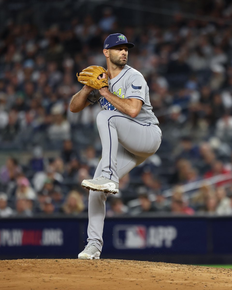 Nick Martinez throws a pitch while wearing a gray Tampa Bay uniform and a navy cap. (Photo: Gabby Ricciardi/Major League Baseball)