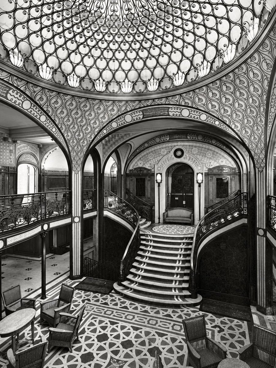 NouveauDeco's tweet photo. The grand staircase aboard the French ocean liner SS Paris from 1921 showing a fusion of Art Nouveau and Art Deco. https://t.co/kNkWJXRjyr