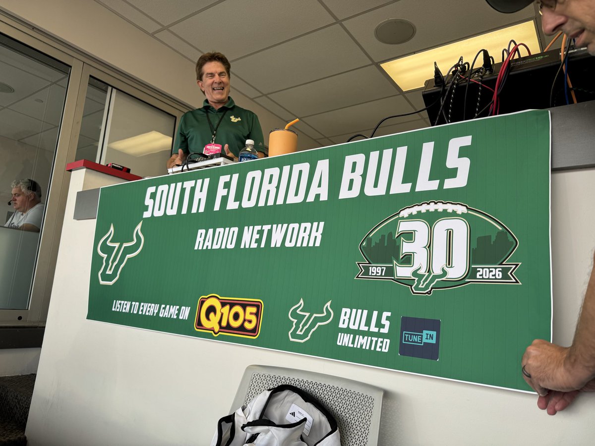 DarekSharp's tweet photo. Very cool new backdrop for our @USFFootball radio booth courtesy of our fantastic engineer @BrettHolcomb8 - that’s not Brett that’s @realrockriley - we’re live at 6 @MyQ105 and @BullsUnlimited https://t.co/AKmDvcFaDQ