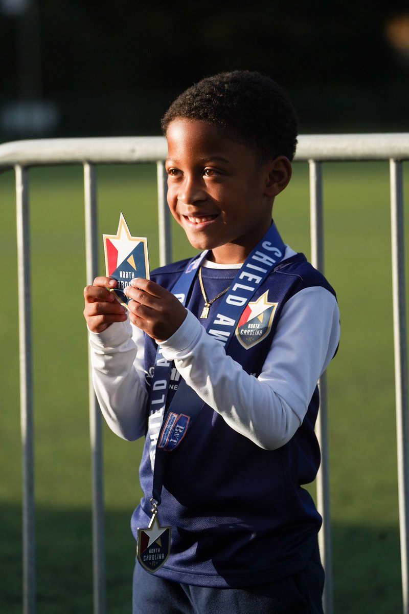 NCFC_Youth's tweet photo. A record-breaking Shield Award Night! 💙⚽️

Congratulations to all 993 of our Shield Award recipients, the most we’ve ever recognized!

Presented by @bt_hvac , with @bt_hvac donating $5 per recipient to our Financial Aid Fund! With 993 recipients, that’s $4,965 to help keep the game accessible to all in our community.

Thank you to @thenccourage for hosting another amazing Shield Award Night and helping us celebrate these outstanding athletes! ⭐️