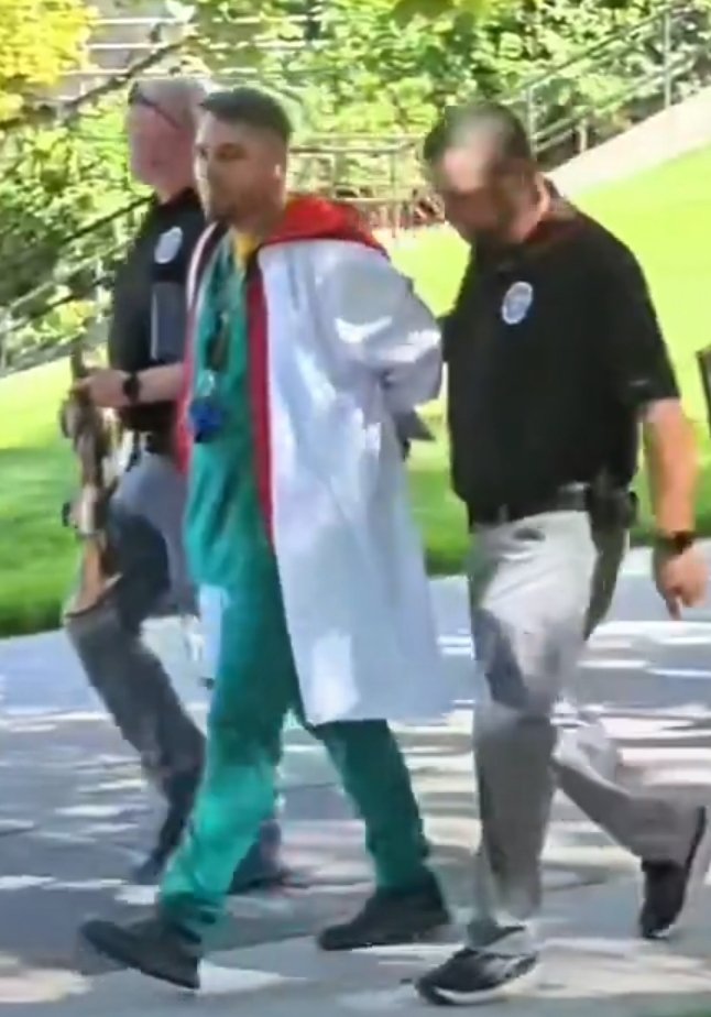 DiligentDenizen's tweet photo. It's a more than a little weird that Charlie Kirk's team were all wearing hospital scrubs later that night 9/10 and so was Russell Kennington who was found at the crime scene hours later. 👀 🤔 https://t.co/z7f0n6uWG5