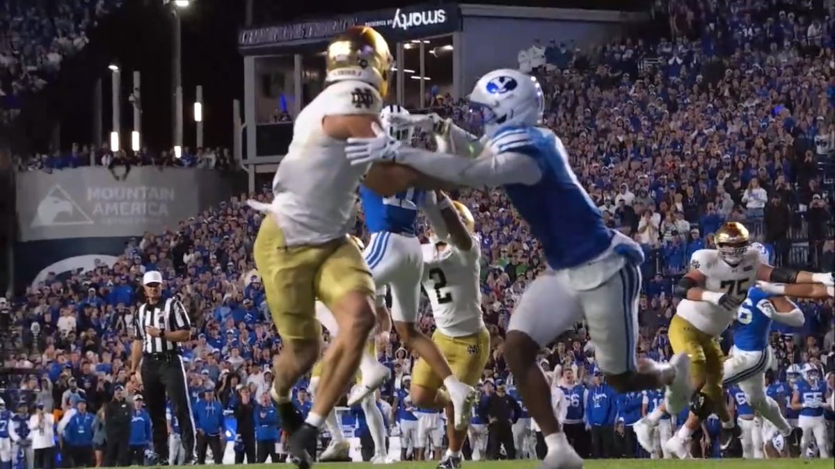 cgasper's tweet photo. LOL. Sure, let’s Zapruder this thing for fun. The BYU DB started impeding way before your photo’s frame with the hand holding . Any photo with the ball that close in the frame is after his initial impeding of the WR/hold here. 

Then they start jockeying. I literally don’t care who won this game. But the reactions here make for a fascinating psychology experiment.