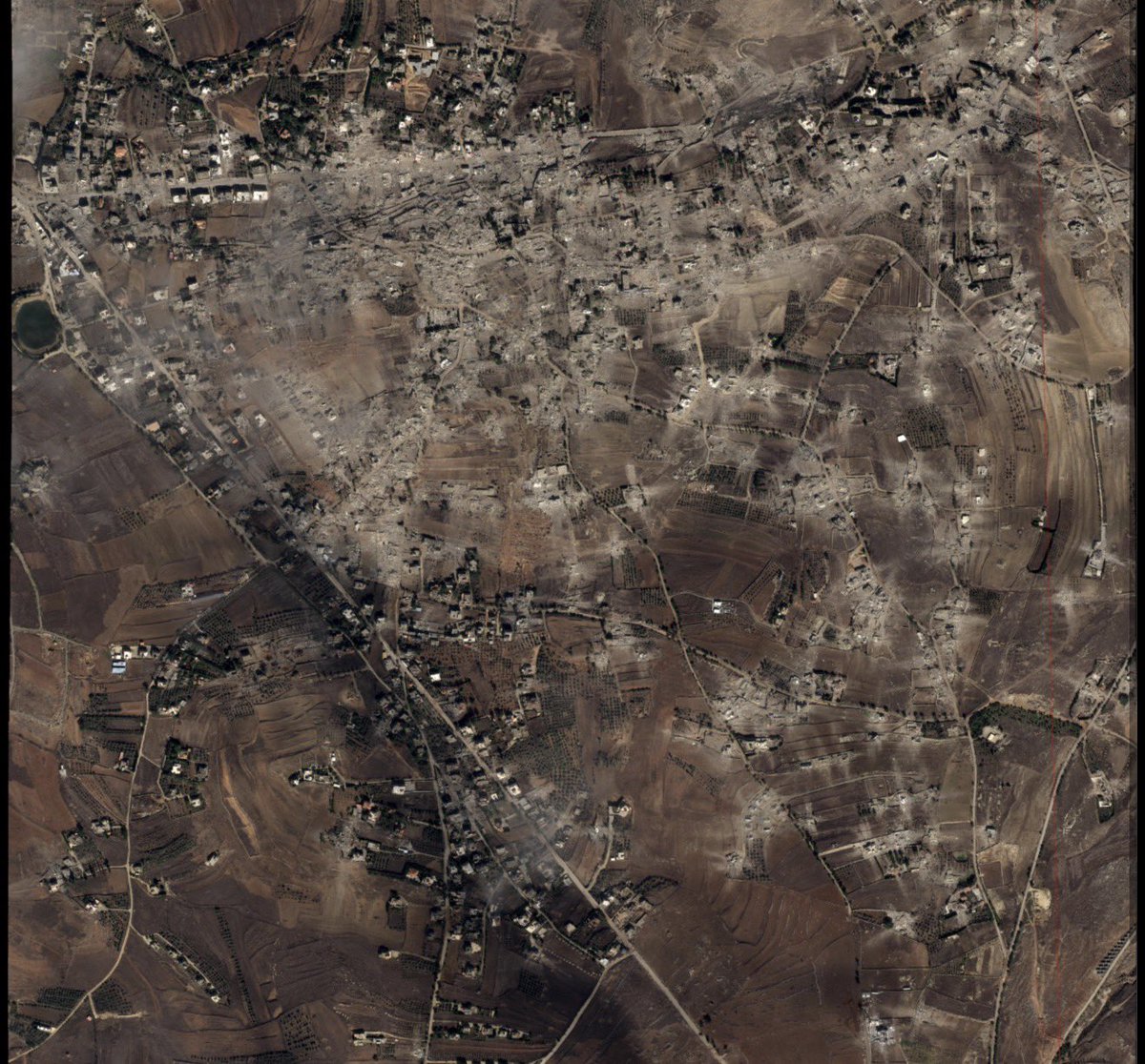 cbonneauimages's tweet photo. Here is a satellite image dated 18-10-2026 of Kfartibnit, Lebanon. 

48 villages have been razed to the ground by the Israeli army, who are still occupying more than 60 towns and villages in Lebanon.

This destruction is funded by the US and EU. https://t.co/TGt6R96fh6
