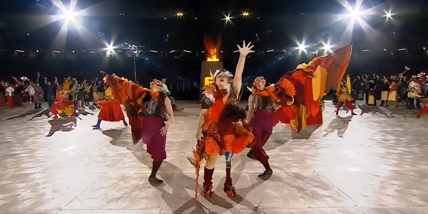 ArchiveInt's tweet photo. With the cauldron already ignited, we seize the night with one final artistic performance here at the Mizuho Park Athletic Stadium, as we see Konoha walk off from her wheelchair to feel the warmth of the flame.

#AichiNagoya2026   #ImagineOneHeart https://t.co/U0OdQrPr76