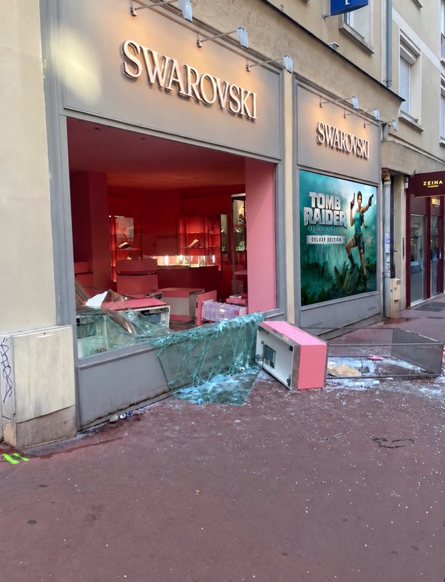 AxelDLX_'s tweet photo. Amid protests in France, Lara Croft’s ‘Legacy of Atlantis’ posters have remained untouched. https://t.co/ERuMTQtLtL