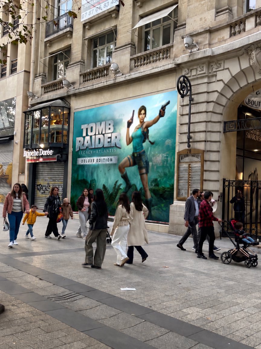 AxelDLX_'s tweet photo. Amid protests in France, Lara Croft’s ‘Legacy of Atlantis’ posters have remained untouched. https://t.co/ERuMTQtLtL