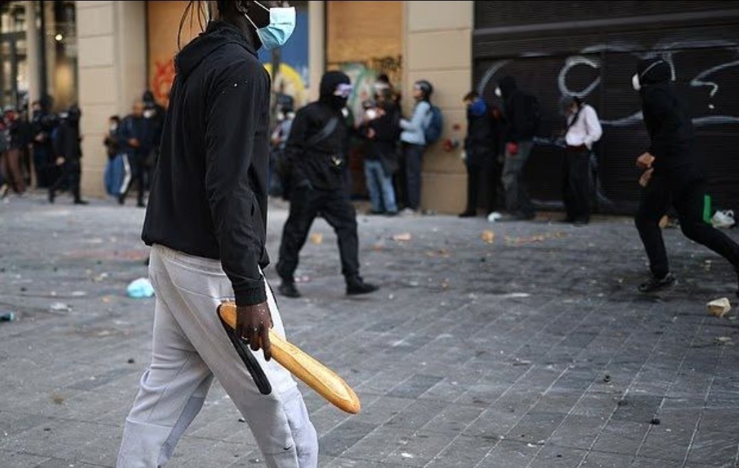 LikeTdo's tweet photo. A migrant holding a French weapon called a baguette https://t.co/Sz6gh7uJl3