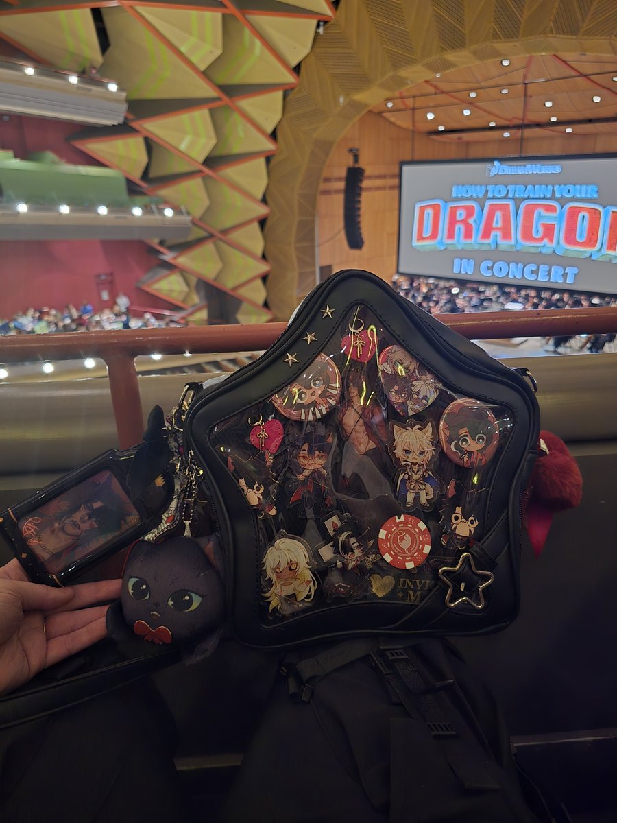 Hillary91494746's tweet photo. Took my @Taiga_Chama bag to the How To Train Your Dragon in concert with my kids. My teenager rolled her eyes at me. https://t.co/kzUnmHgLbh