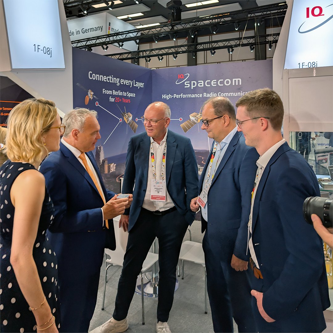 IQspacecom's tweet photo. Day three of IAC 2026, and our booth is still buzzing 🌌🛰️ Today, we had the pleasure of welcoming Dr.-Ing. Walther Pelzer, Director General of the Space Agency at DLR, together with Principal Managing Director Marie-Christine von Hahn from the BDLI to our booth 1F-08J. https://t.co/CcsS7mnWfm