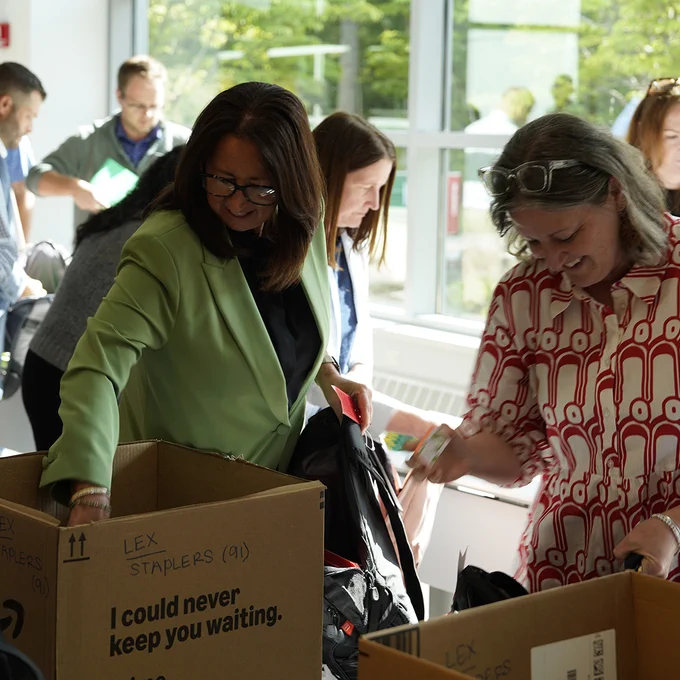Our leadership team came together to support community members in Lansing, Nashville and Chicago, packing school backpacks, snack bags, and hygiene kits