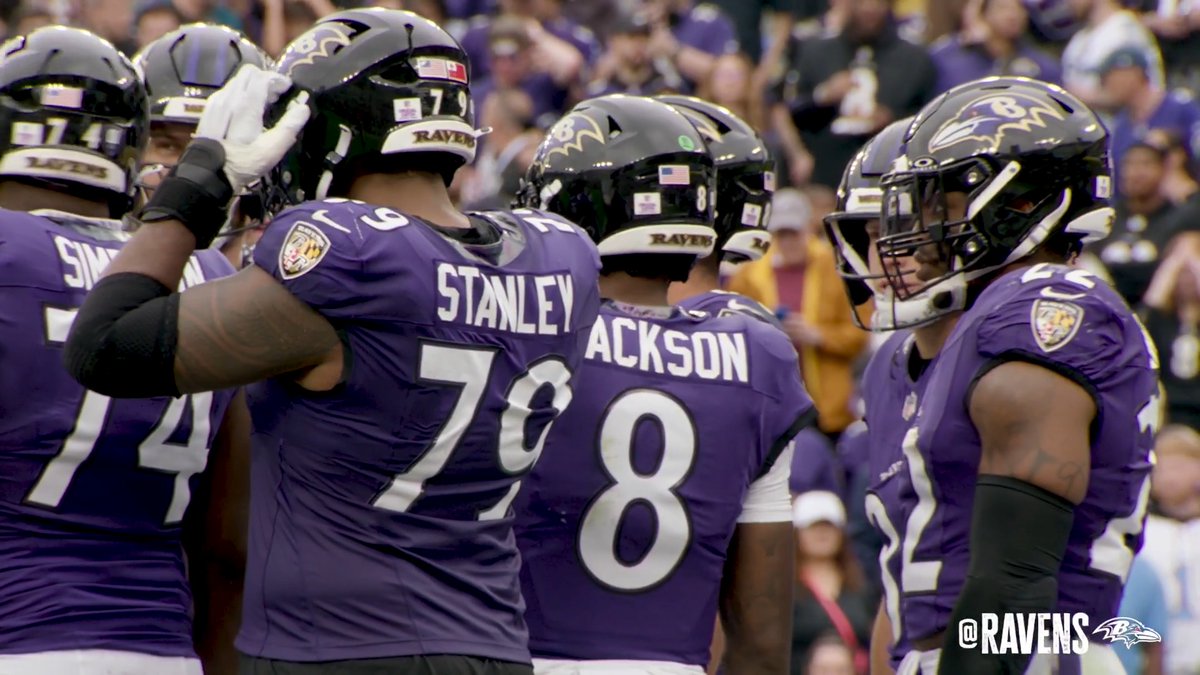 Baltimore Ravens players, including Stanley (#79) and Jackson (#8), gather on the field wearing their purple jerseys with "RAVENS" displayed on their black helmets, celebrating together as the "@RAVENS" watermark appears in the corner, aligning with the post promoting Lamar Jackson's game-winning performance and "Wired TONIGHT!" feature.