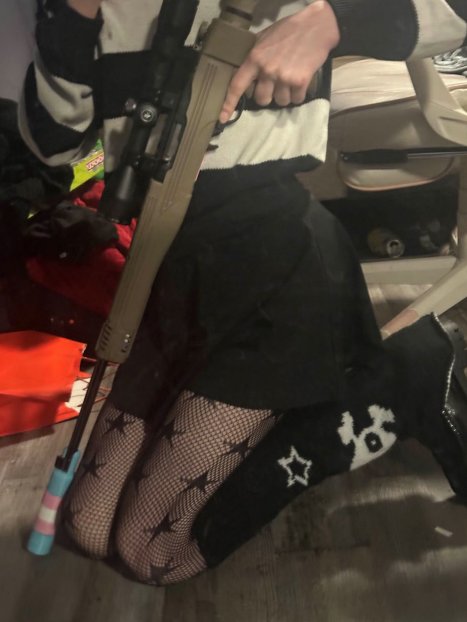 KanekoaTheGreat's tweet photo. NEW: The DOJ released photos of the Tumbler Ridge school shooter's guns: a shotgun with a trans flag-colored sticker, posed before a trans flag, and a rifle with a suppressor in trans flag colors.

Jesse Van Rootselaar killed eight people, six of them children aged 11 to 13.

Van Rootselaar sent the photos on Discord to James Cody Bryant, who also identifies as transgender.

Bryant, 30, of Bellingham, Washington, was charged yesterday with conspiracy to murder.

Prosecutors say he helped plan the shooting and agreed to livestream it.