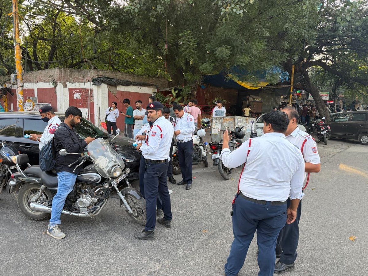 dcptcr's tweet photo. A special enforcement drive conducted at Malkaganj Chowk &amp; Delhi University/North Campus, cracking down on tinted glasses, helmet violations, triple riding and other traffic offences.

127 challans issued to promote safer roads and reinforce compliance with traffic rules. https://t.co/k609ZXTXyd